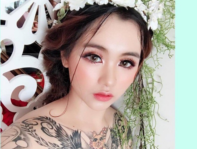 Cô dâu xinh đẹp giải thích lý do xăm kín cơ thể