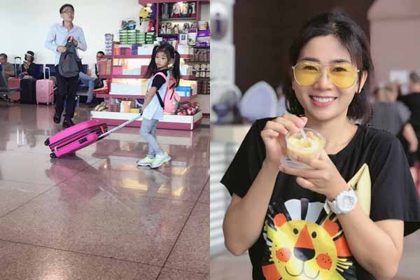 Con gái Mai Phương phụ mẹ đẩy hành lý khi đi du lịch